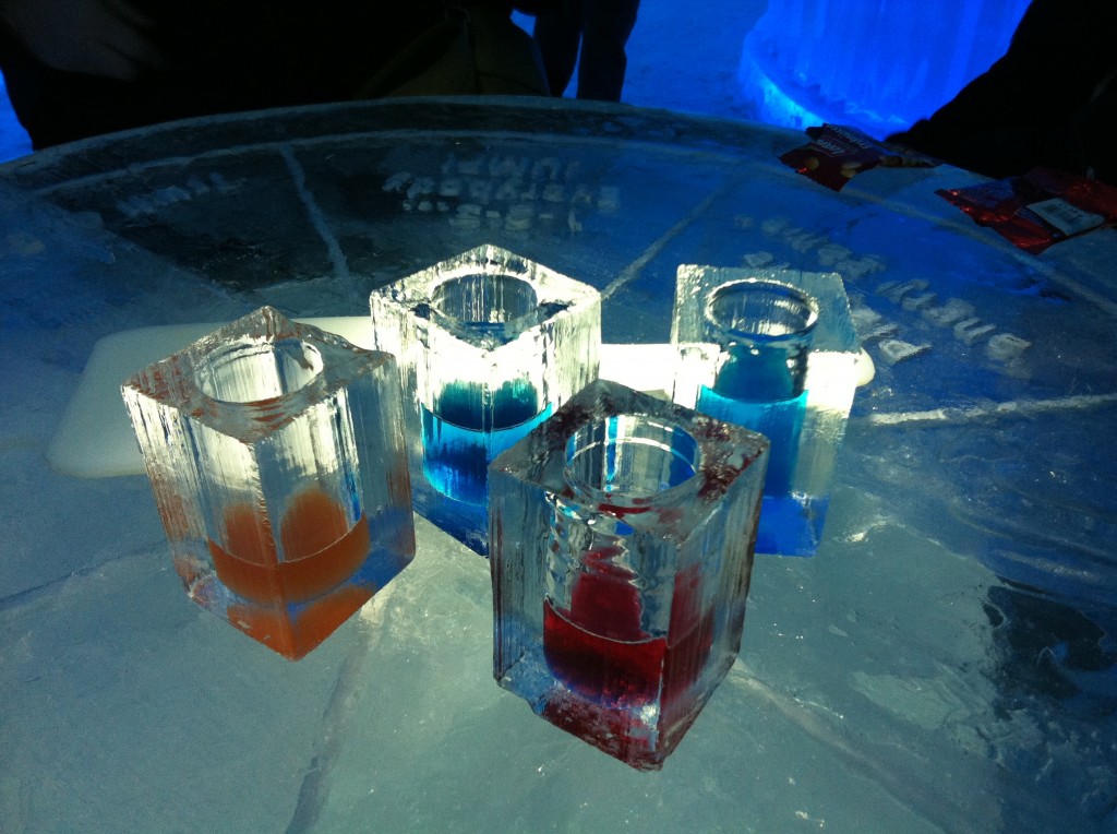 Drinks at the Ice Hotel - vodka cocktails in glasses made of ice, sitting on an ice table!